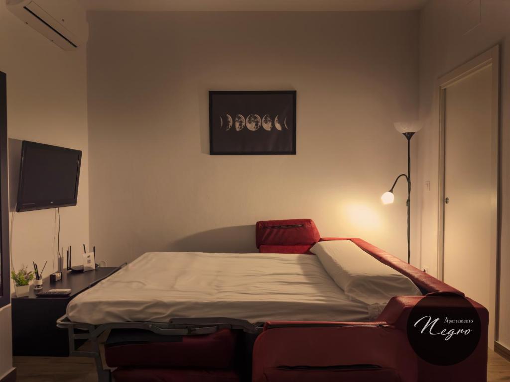 Postel nebo postele na pokoji v ubytování Apartamentos Blanco & Negro
