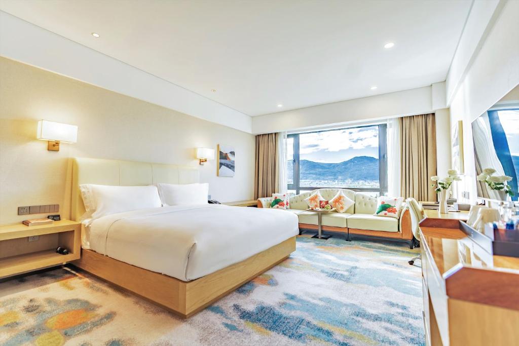 Postel nebo postele na pokoji v ubytování Hilton Lijiang