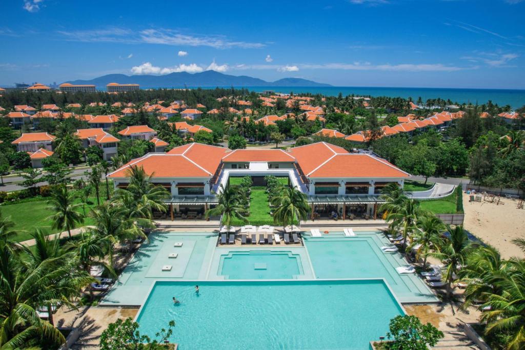 an aerial view of a resort with a swimming pool at Ocean Villa Pool Retreat In Da Nang in Danang