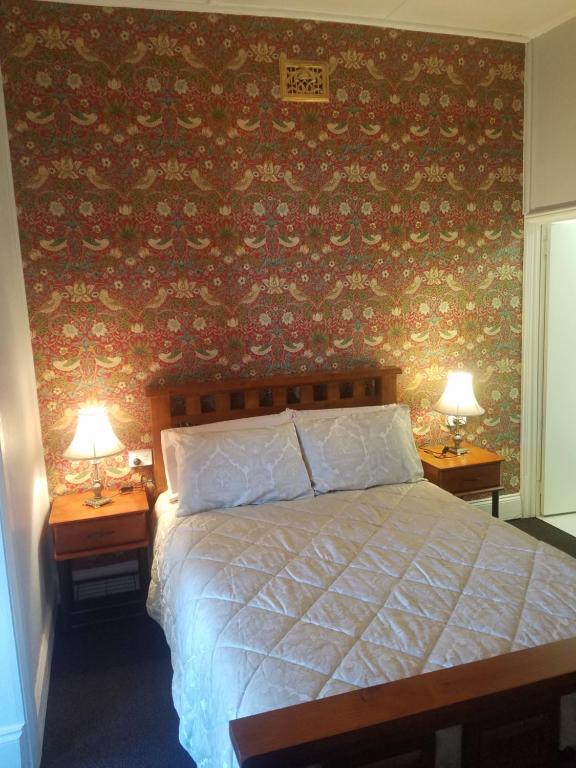 Postel nebo postele na pokoji v ubytování Hunters Hotel