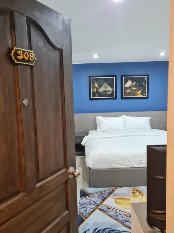 Postel nebo postele na pokoji v ubytování Poonsuk Place Hotel