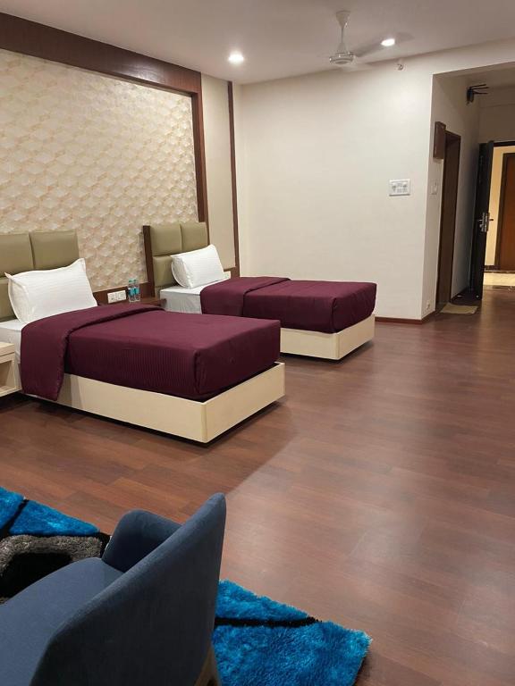 Postel nebo postele na pokoji v ubytování Hotel Swamiraj