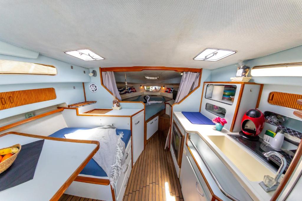a view of the inside of a boat with a kitchen at EVASION in San Miguel de Abona