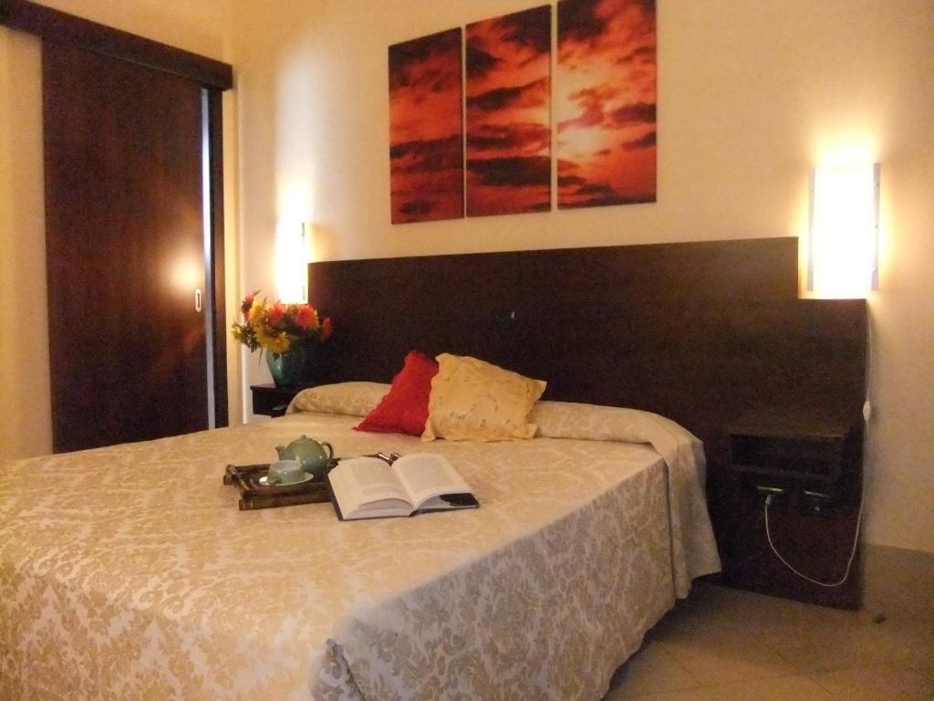 Posteľ alebo postele v izbe v ubytovaní Hotel Villa Ionia