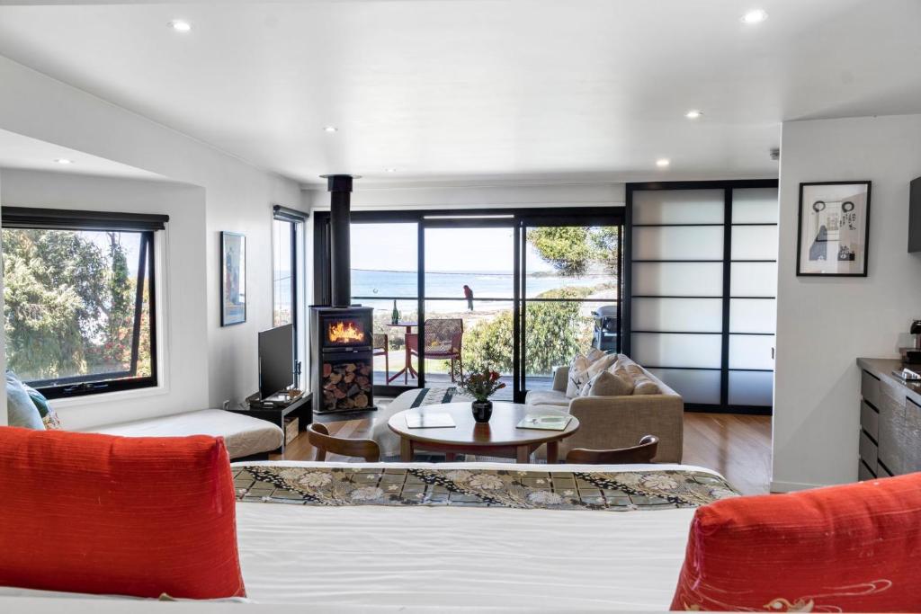 a living room with a view of the ocean at Sea Zen in Wye River