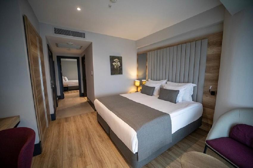 Postel nebo postele na pokoji v ubytování Seven For Life Thermal Hotel
