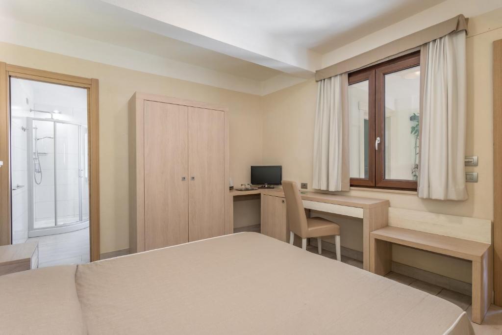 Postel nebo postele na pokoji v ubytování Hotel Belvir