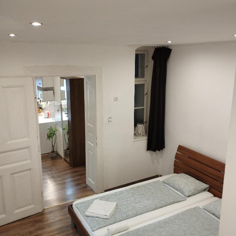 Postel nebo postele na pokoji v ubytování Apartmány 77