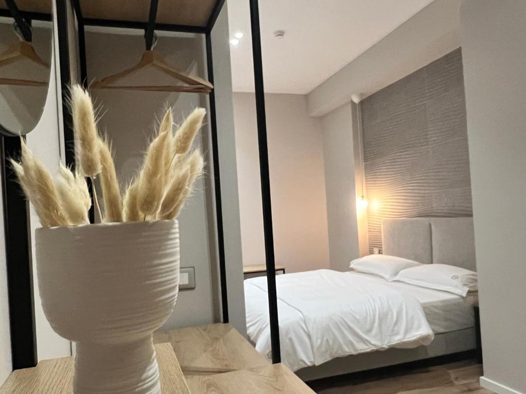 Postel nebo postele na pokoji v ubytování Enzo rooms & apartment Blloku