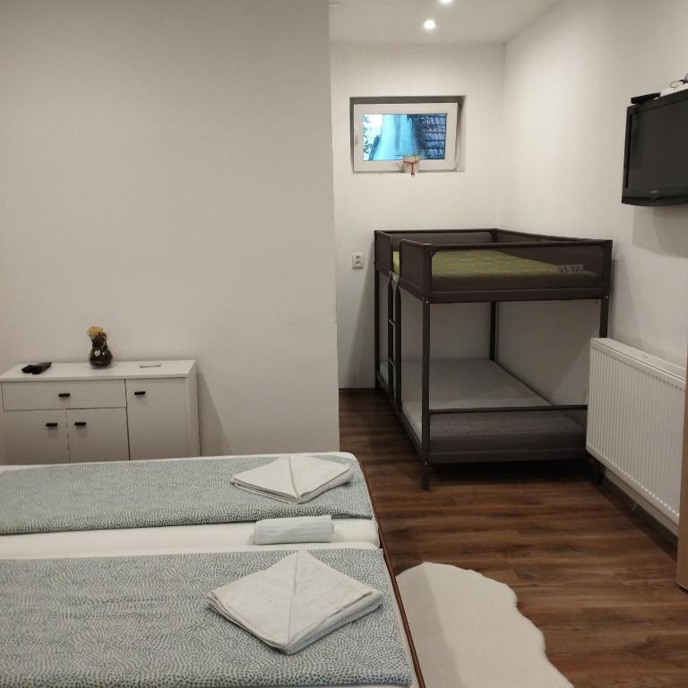Postel nebo postele na pokoji v ubytování Apartmány 77