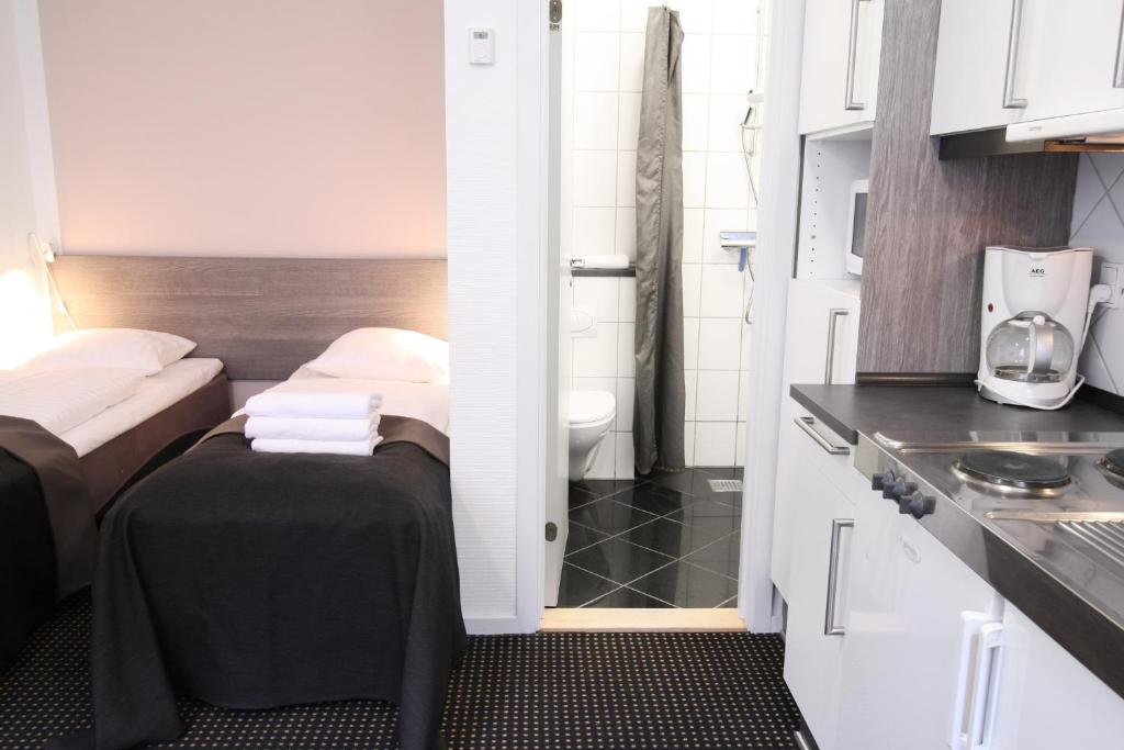 Kuchyň nebo kuchyňský kout v ubytování Hotel Aarhus City Apartments