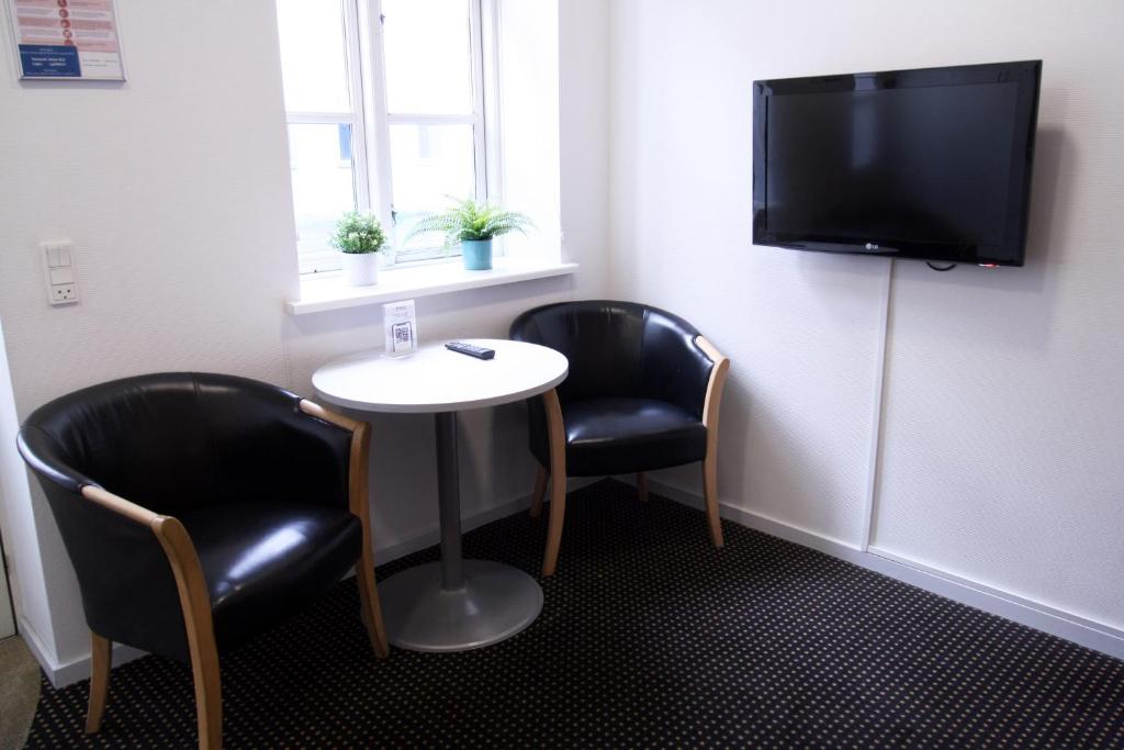 TV a/nebo společenská místnost v ubytování Hotel Aarhus City Apartments
