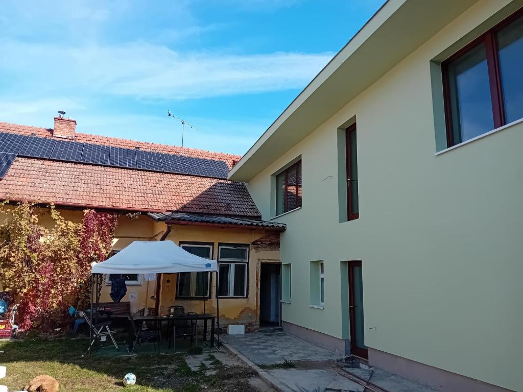 a house with solar panels on the roof at Statek in Veverská Bítýška