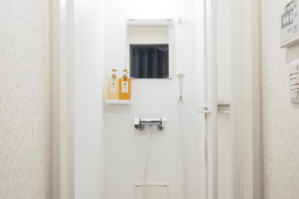 Koupelna v ubytování Hostel LodgingToyko Minowa