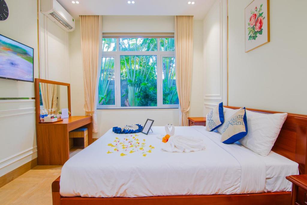Кровать или кровати в номере Villa Amory Mui Ne