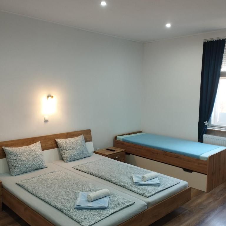 Postel nebo postele na pokoji v ubytování Apartmány 77
