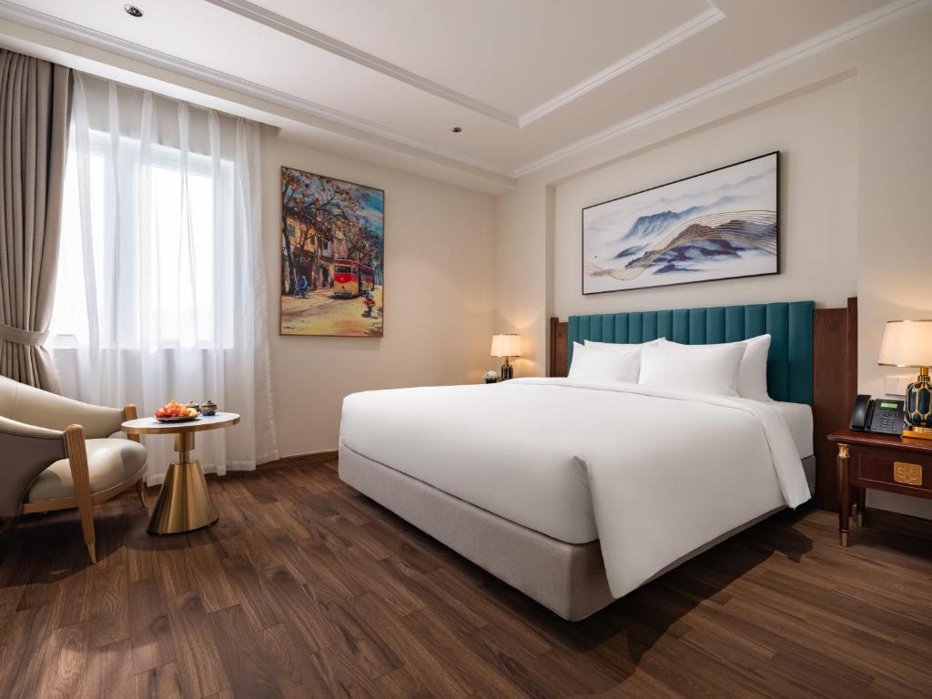 Postel nebo postele na pokoji v ubytování L'Signature Hotel & Spa
