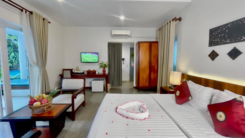 Postel nebo postele na pokoji v ubytování Indra Angkor Residence