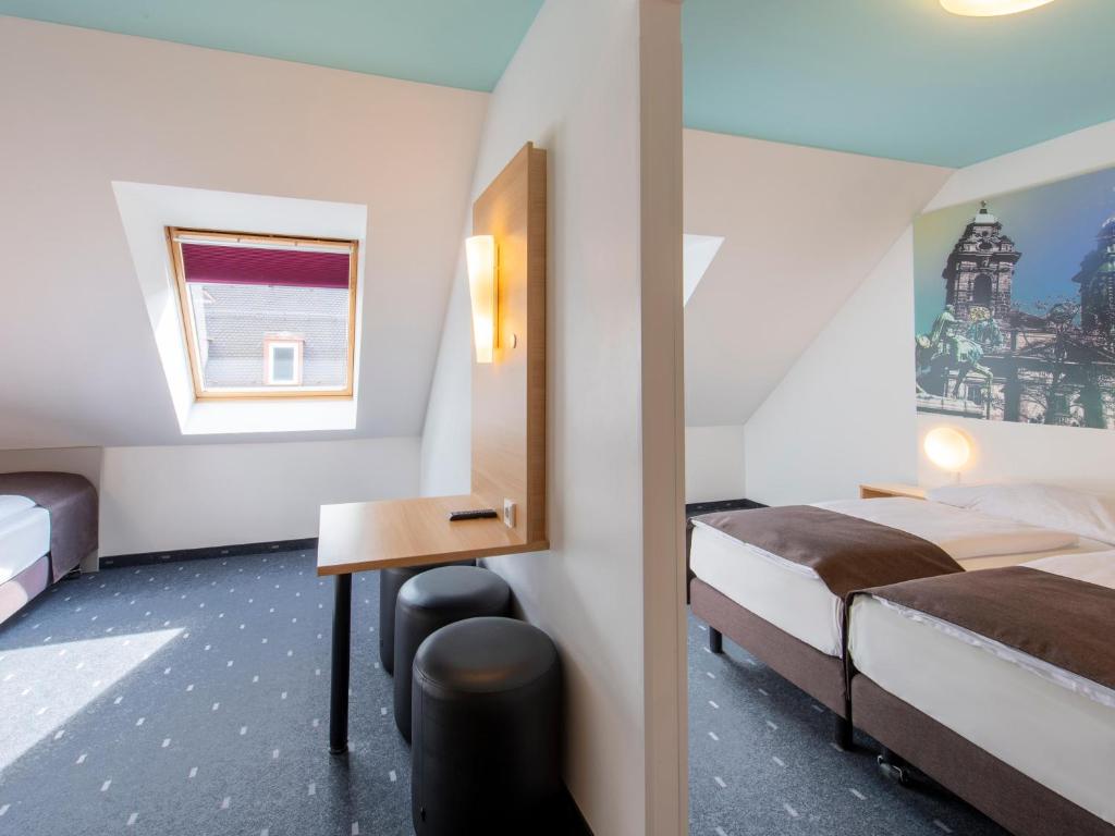 Postel nebo postele na pokoji v ubytování B&B Hotel Nürnberg-City