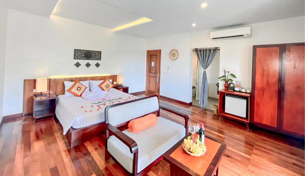 Postel nebo postele na pokoji v ubytování Indra Angkor Residence