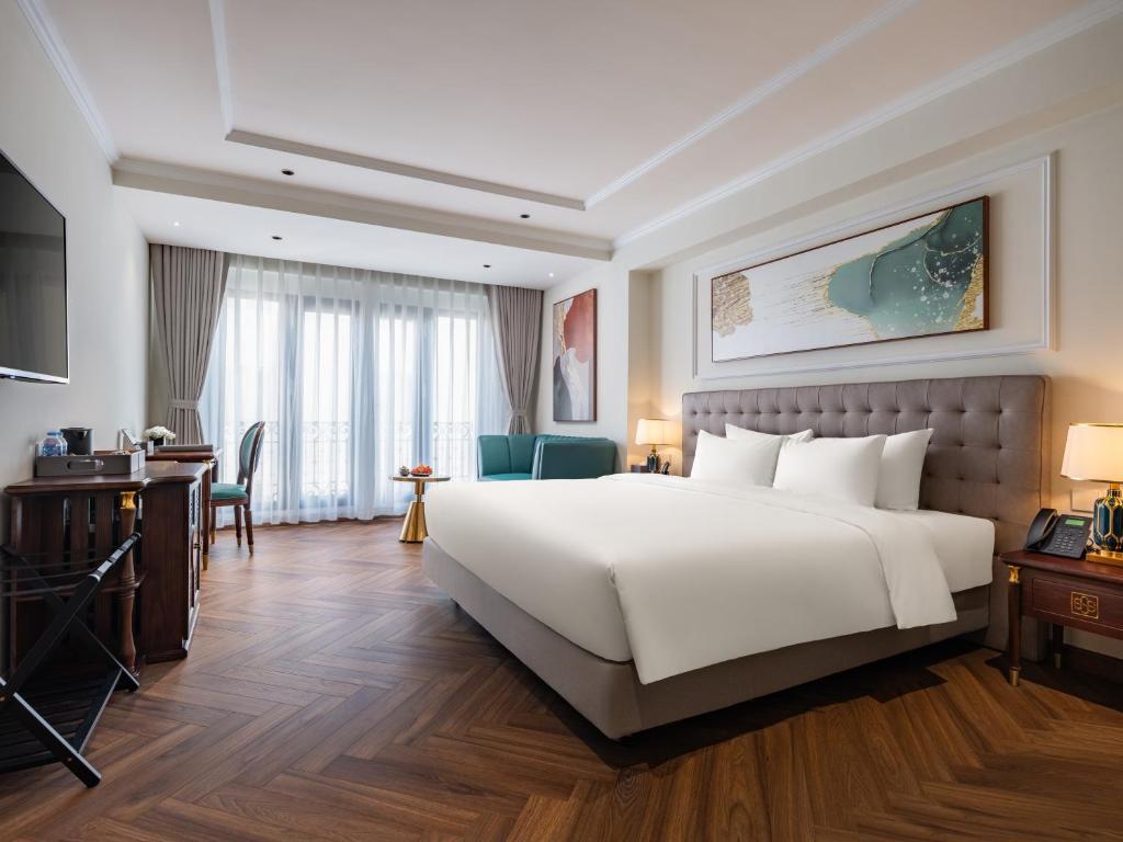 Postel nebo postele na pokoji v ubytování L'Signature Hotel & Spa