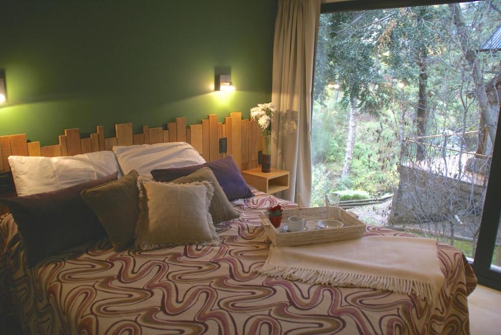 En eller flere senge i et værelse på El Oasis Apart Hotel