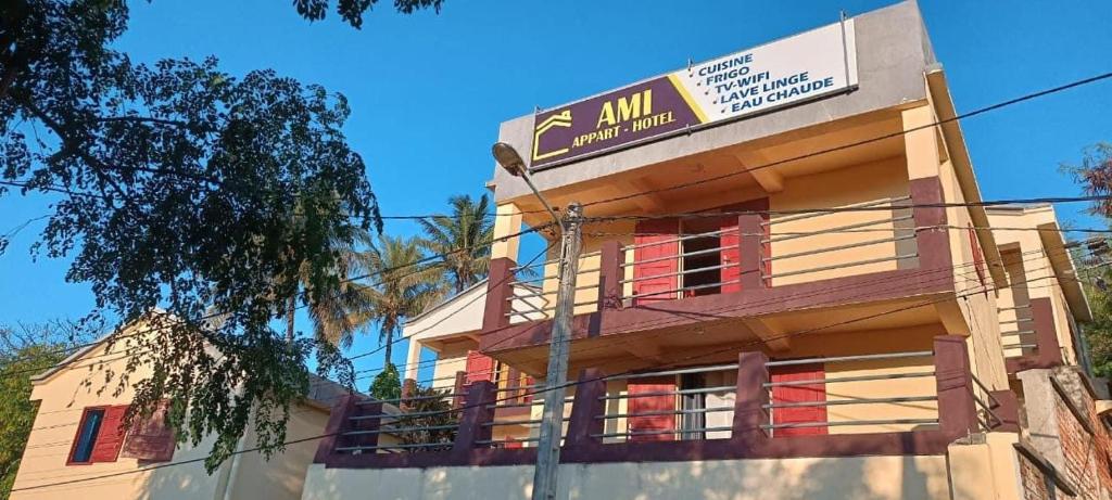 a building with a sign on the side of it at Studio Standard (AMI Appart-hotel) - Taolagnaro in Fort Dauphin