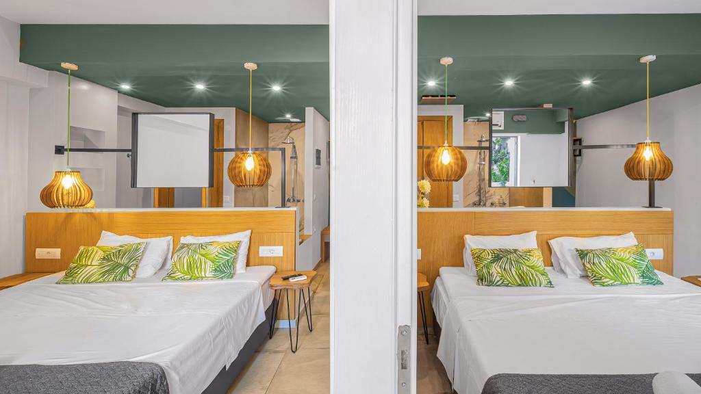 Postel nebo postele na pokoji v ubytování Sunshine Boutique Hotel