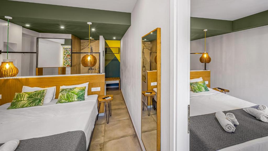 Postel nebo postele na pokoji v ubytování Sunshine Boutique Hotel