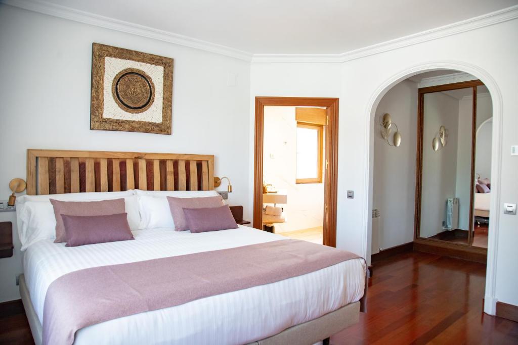 Postel nebo postele na pokoji v ubytování Hotel Spa Viña Real