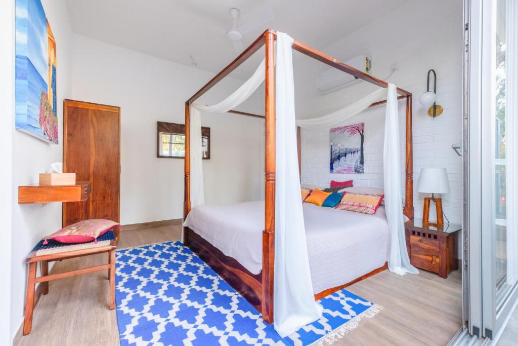 Postel nebo postele na pokoji v ubytování El Rocio Estate 2bhk in Assagao 8 min away from Vagator