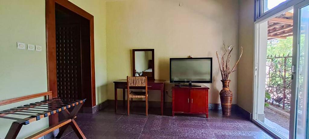 TV a/nebo společenská místnost v ubytování Hotel Safari Gate