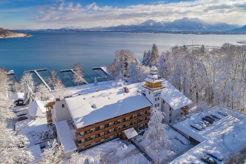 an aerial view of a hotel in the snow at Yachthotel Chiemsee GmbH in Prien am Chiemsee