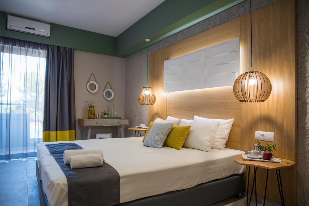 Postel nebo postele na pokoji v ubytování Sunshine Boutique Hotel