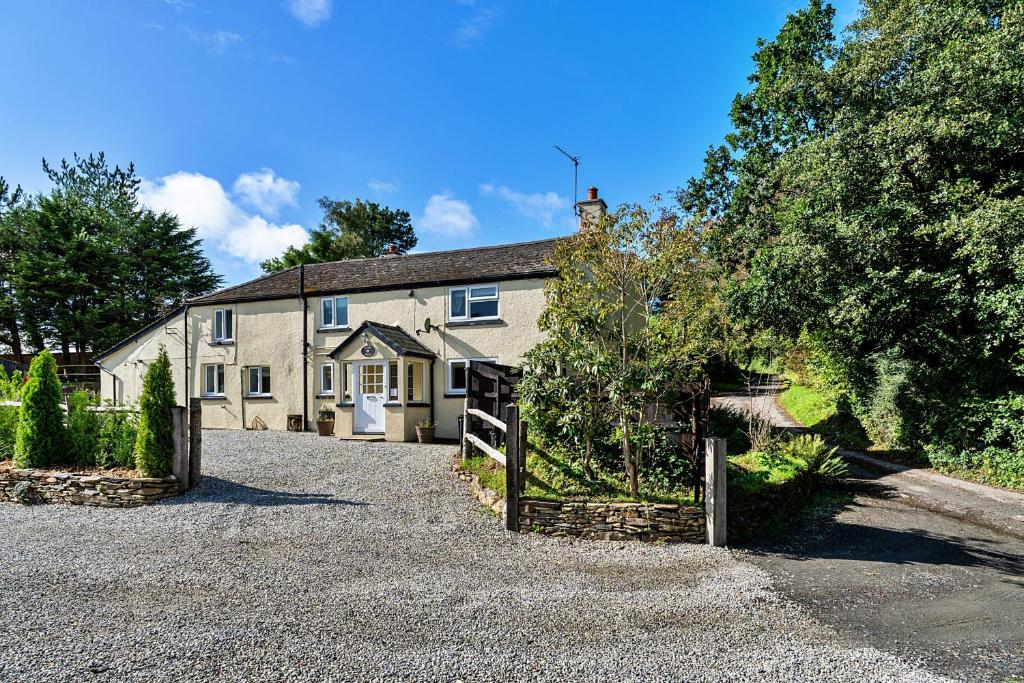 a house with a driveway in front of it at Finest Retreats - Heath Hills in Okehampton