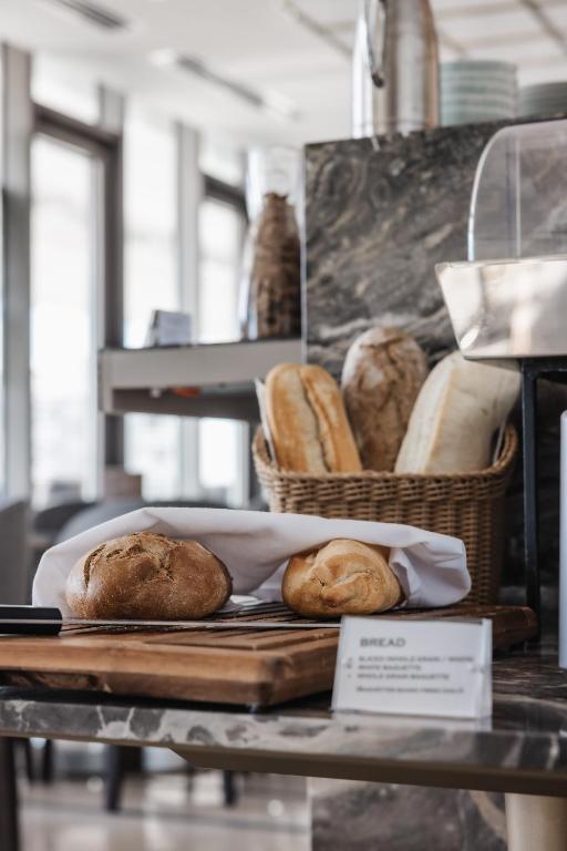 two loaves of bread on a table in a bakery at Limassol Del Mar in Limassol
