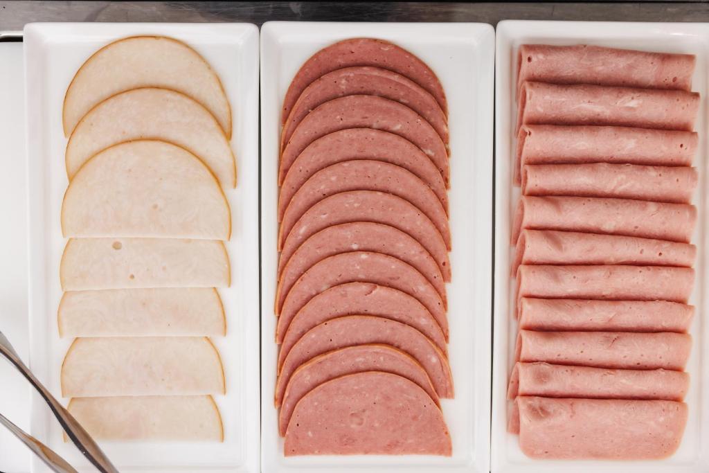 four different types of meats on a plate at Limassol Del Mar in Limassol