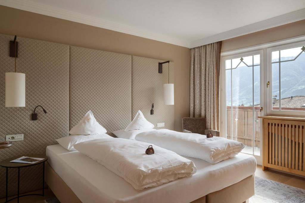 Postel nebo postele na pokoji v ubytování Hotel Burggräflerhof