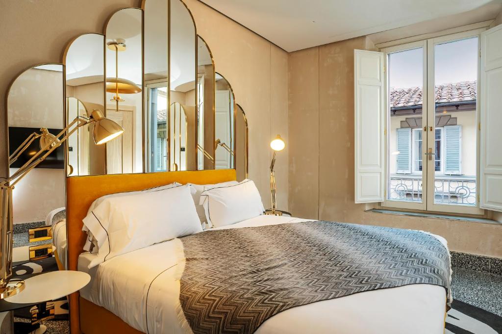 Hotel Calimala Florenceにあるベッド