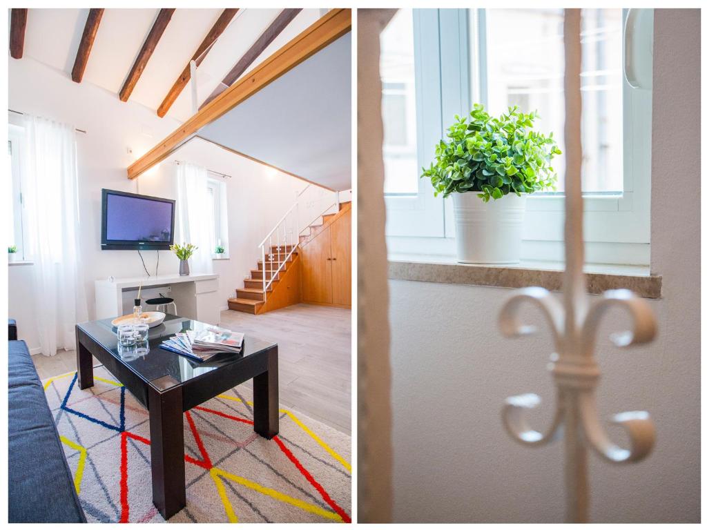 Televízia a/alebo spoločenská miestnosť v ubytovaní Furioso Apartments
