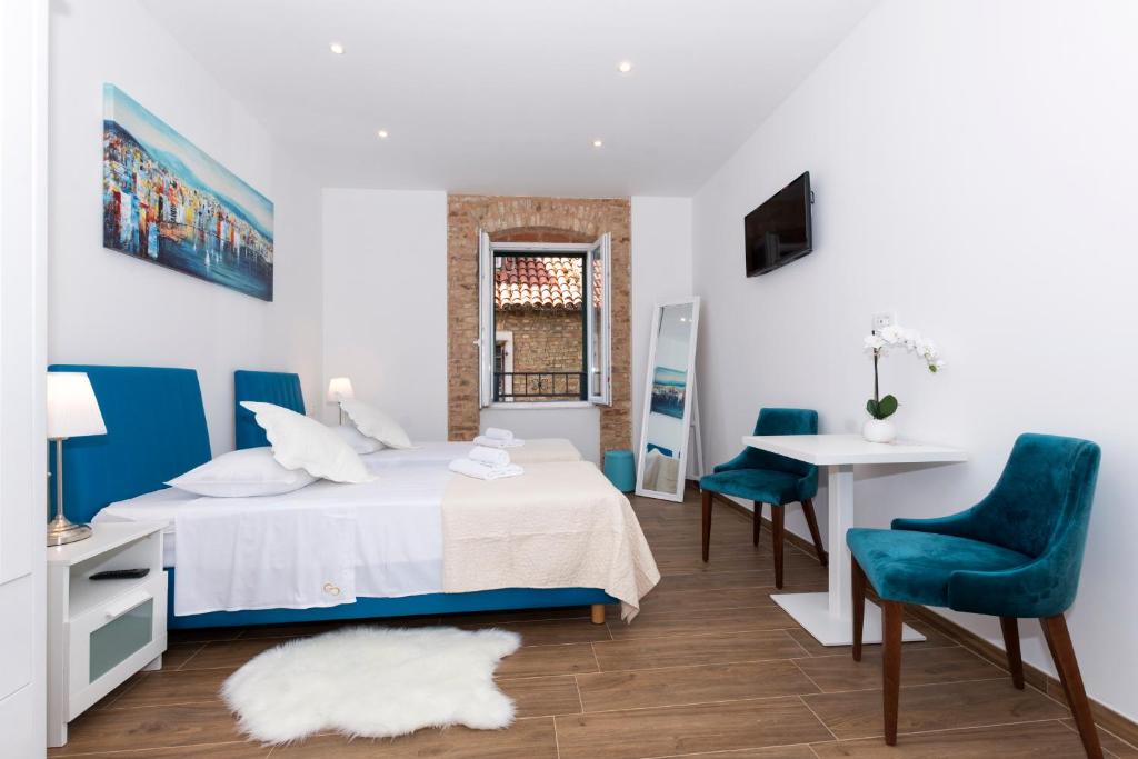 Postel nebo postele na pokoji v ubytování Peruzovic Rooms 3