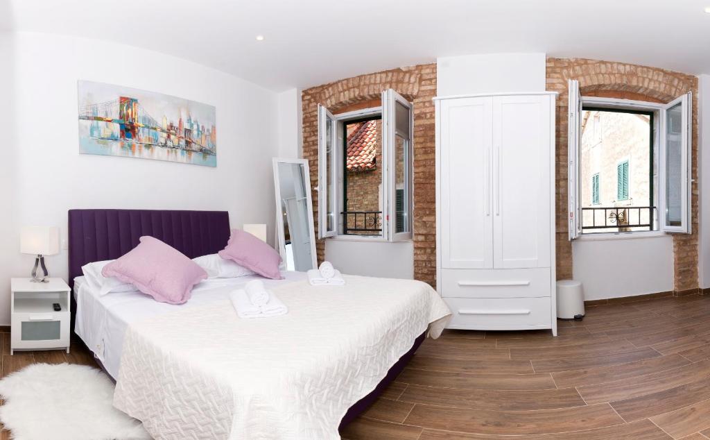 Postel nebo postele na pokoji v ubytování Peruzovic Rooms 3
