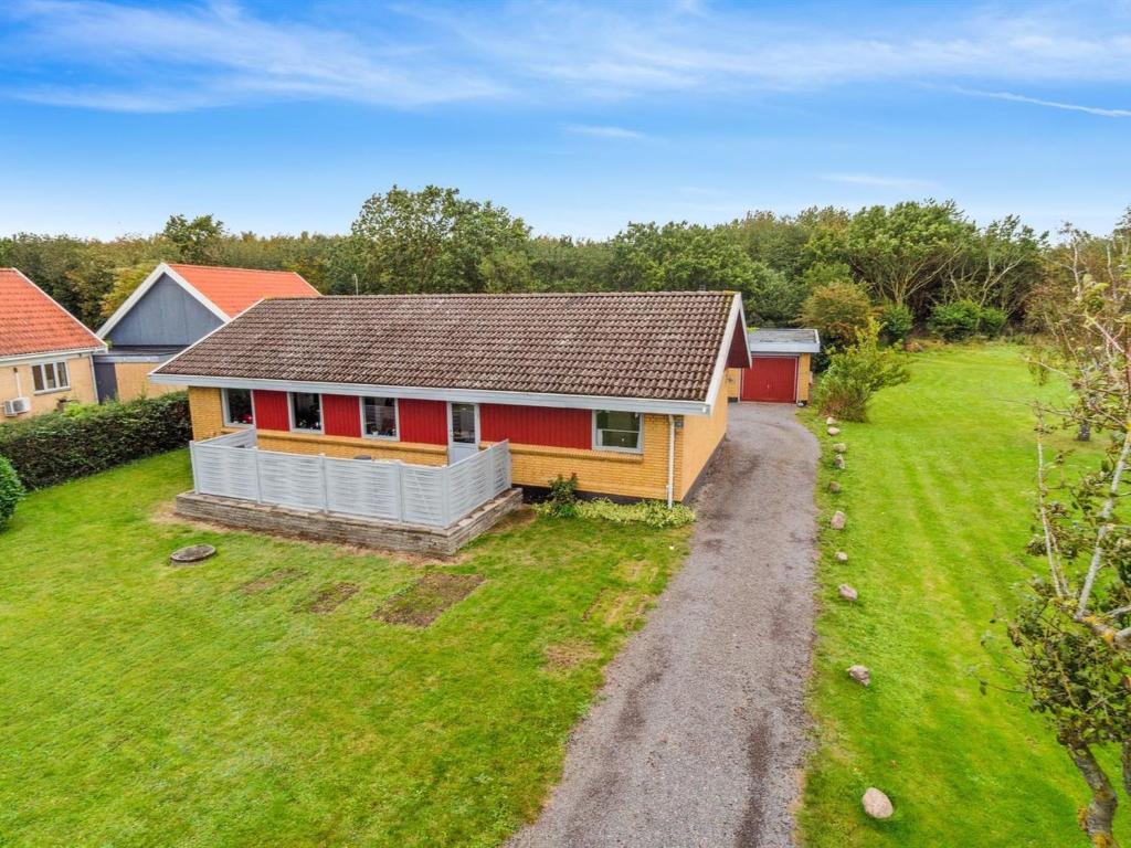 an aerial view of a house with a yard at Holiday Home Ravn - 3-3km from the sea in Bornholm by Interhome in Vester Sømarken