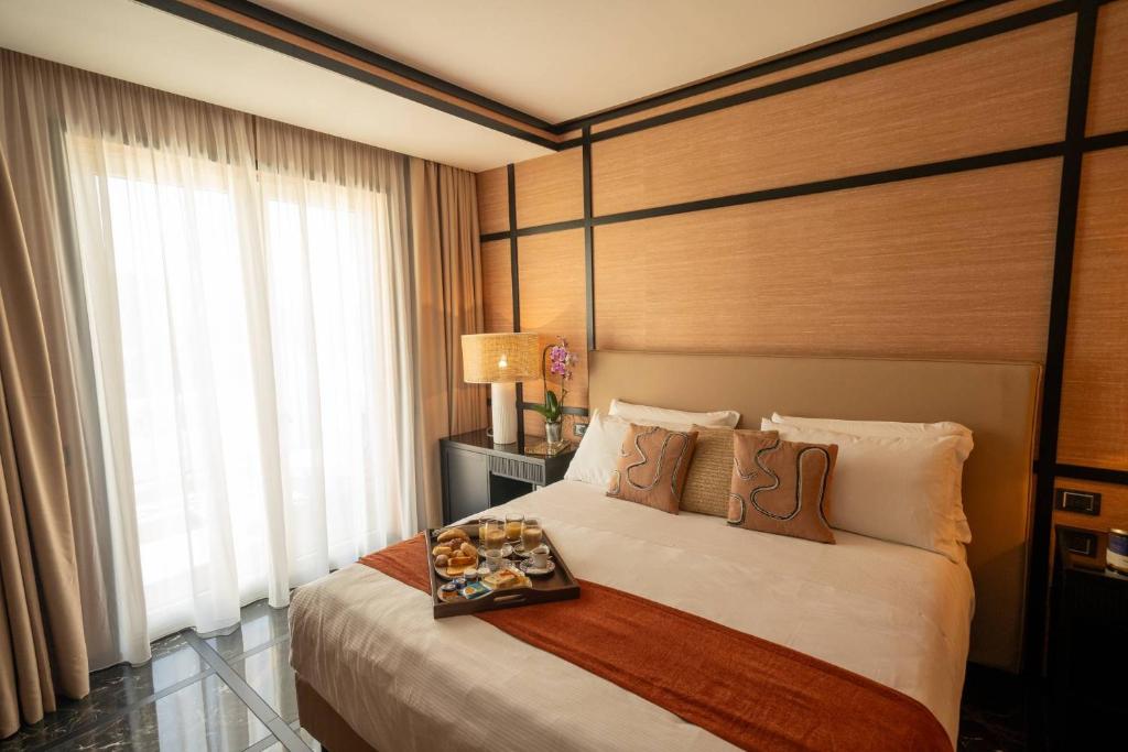 A bed or beds in a room at Hotel Il Gabbiano