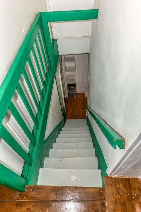 a stairway with green railing and white stairs at Le Charme Antique¶ Belle maison¶ Centre Gières in Gières