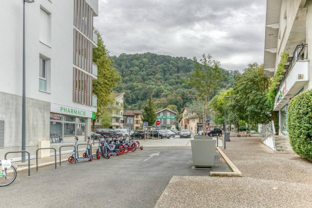 a street in a town with bikes parked next to buildings at Le Charme Antique¶ Belle maison¶ Centre Gières in Gières