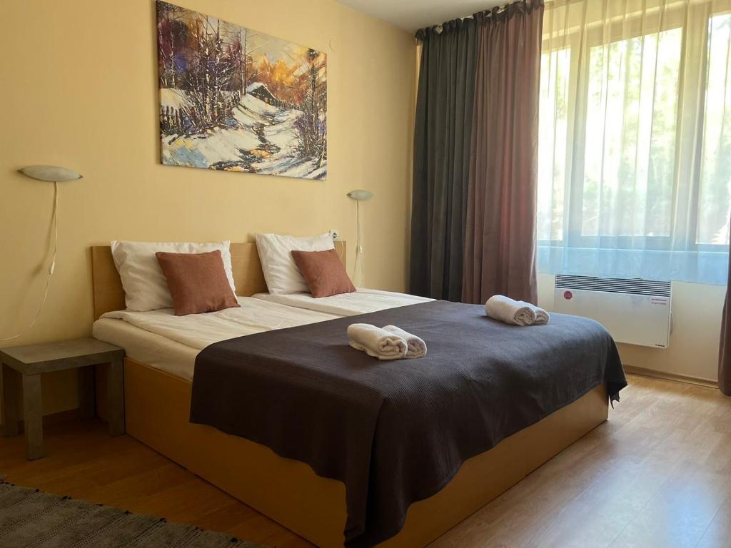 Postel nebo postele na pokoji v ubytování Minkov Apartments, Замъка 2