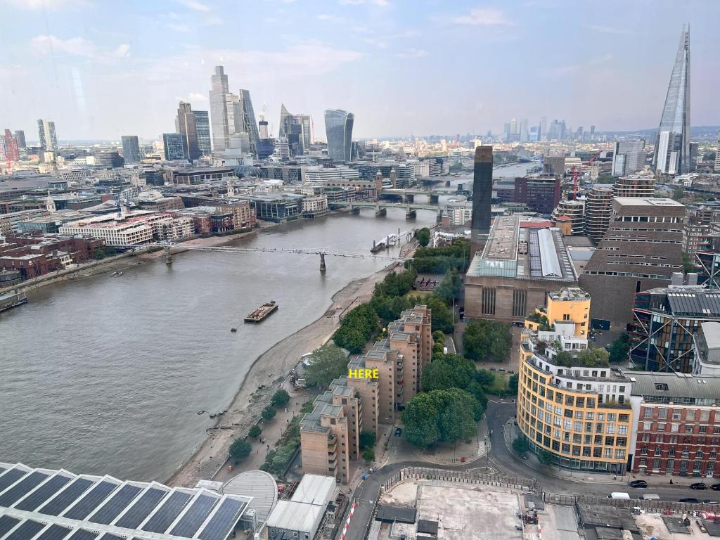 a view of a city with a river and buildings at Great River Thames View Entire Apartment in The Most Central London in London