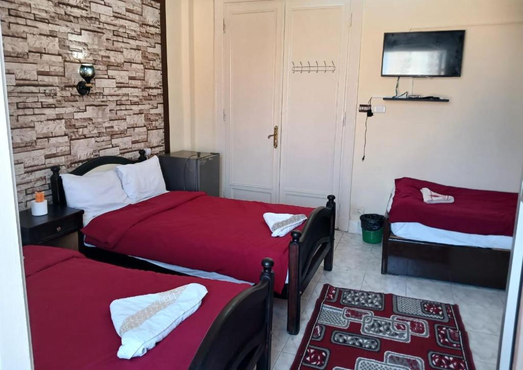 Postel nebo postele na pokoji v ubytování New Palace Hotel