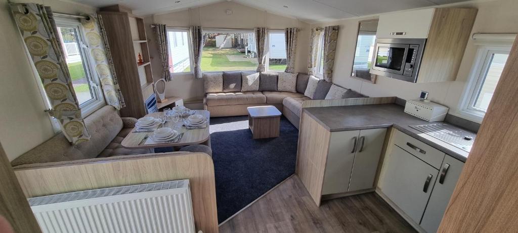 an aerial view of a living room and kitchen in an rv at 123 Barmouth bay in Barmouth